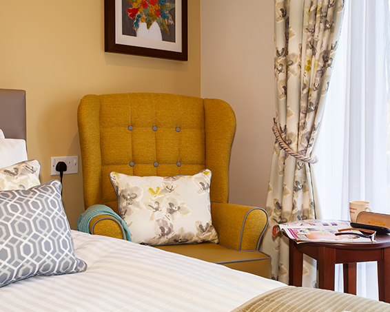 A close up of an armchair in one of the bedrooms at Penrose Court Care Home