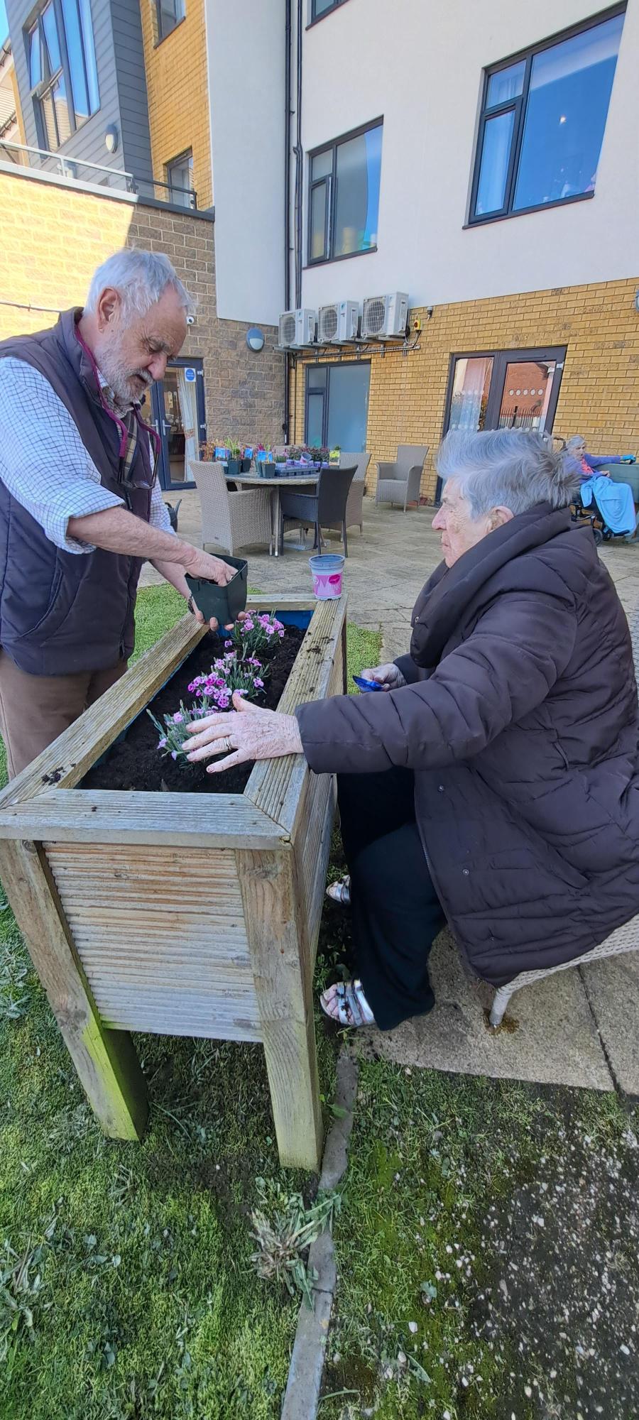 residents planting flowers