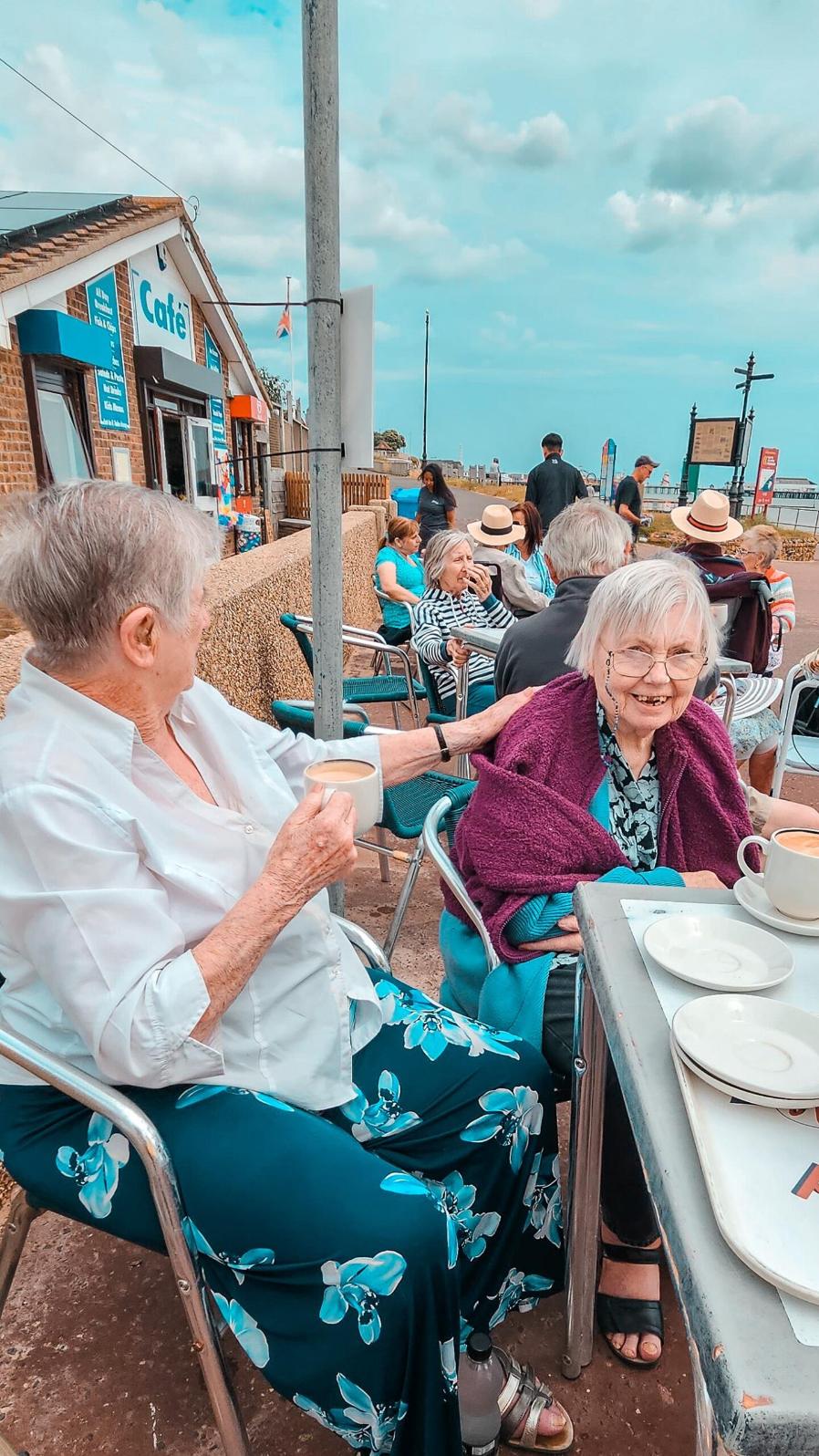 residents sat on the beach together