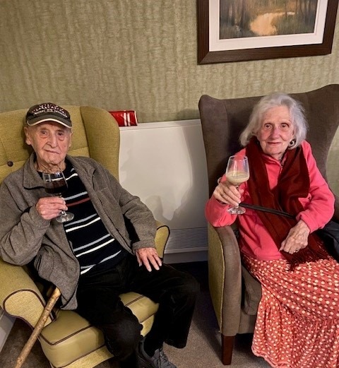 residents enjoying drinks together for their anniversay