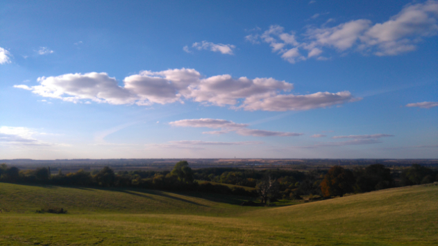 landscape of the sky with some clouds and hills